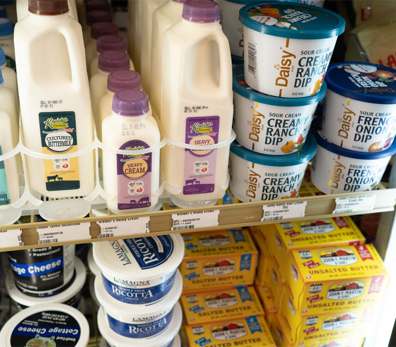 Refrigerator with buttermilk, heavy cream, sour cream dips, ricotta cheese, and butter.